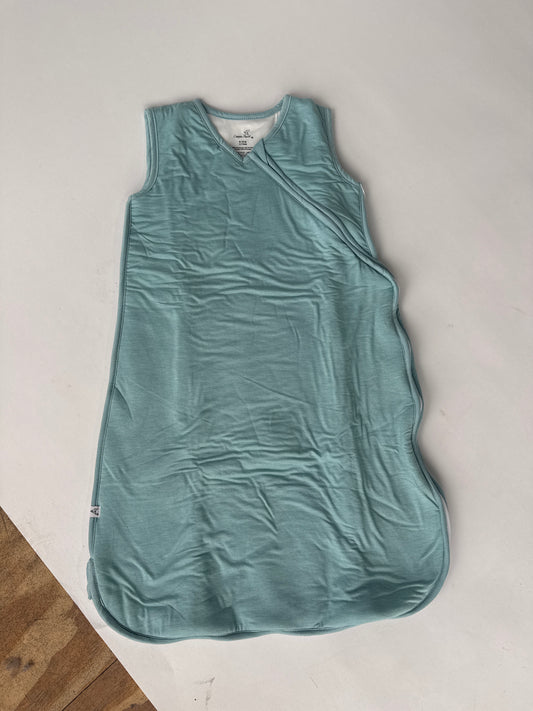Copper Pearl teal baby sleep sack with wrap neckline, laid flat