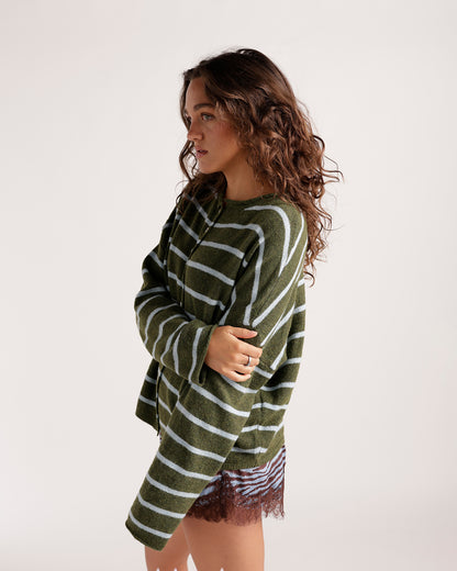 Olive green and baby blue striped knit cardigan with long sleeves, worn open