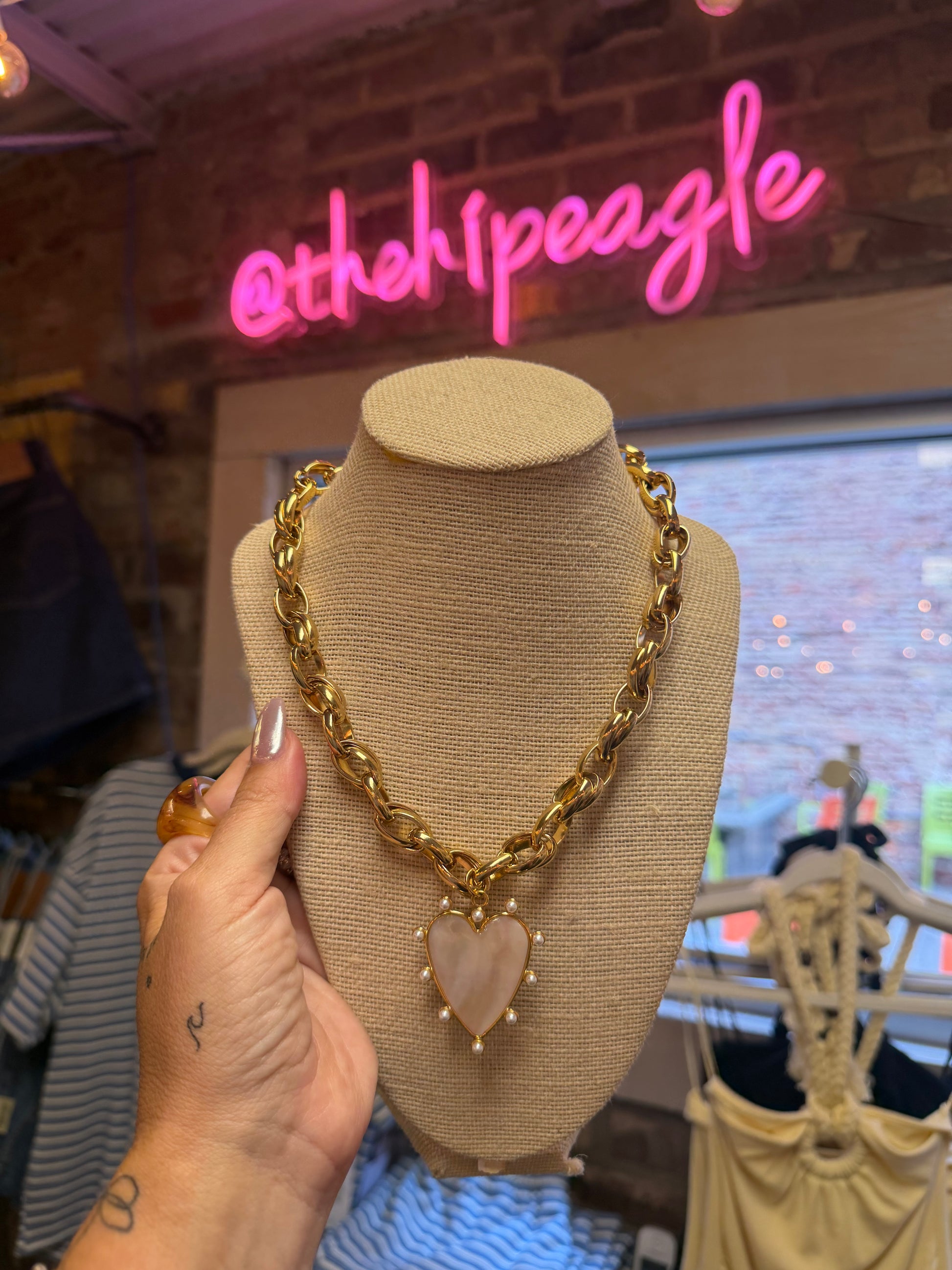 Shop the Beljoy 24/7 Wear waterproof gold chain necklace featuring a chunky gold chain, ivory marble heart pendant, and pearl accents. A timeless statement necklace perfect for everyday wear.