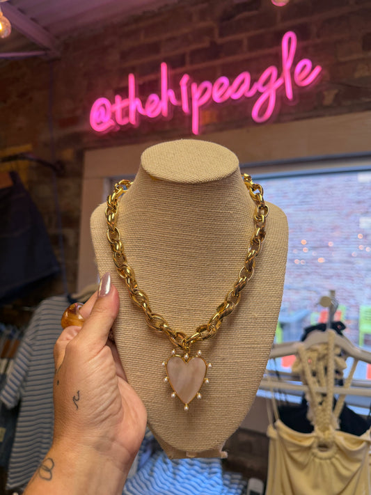 Shop the Beljoy 24/7 Wear waterproof gold chain necklace featuring a chunky gold chain, ivory marble heart pendant, and pearl accents. A timeless statement necklace perfect for everyday wear.