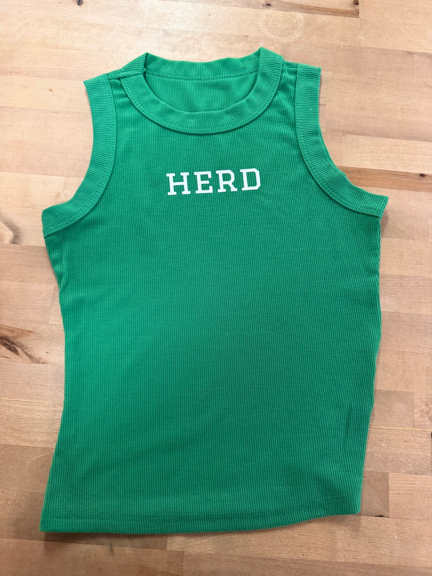Kelly green ribbed sleeveless tank top with white HERD graphic on chest