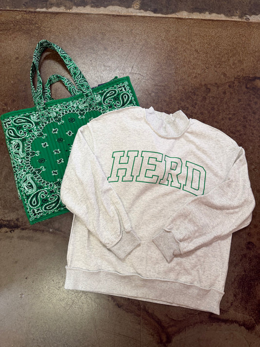 Show your Marshall pride in this gray mock neck sweatshirt featuring bold kelly green outlined “HERD” lettering. Perfect for Thundering Herd game days!