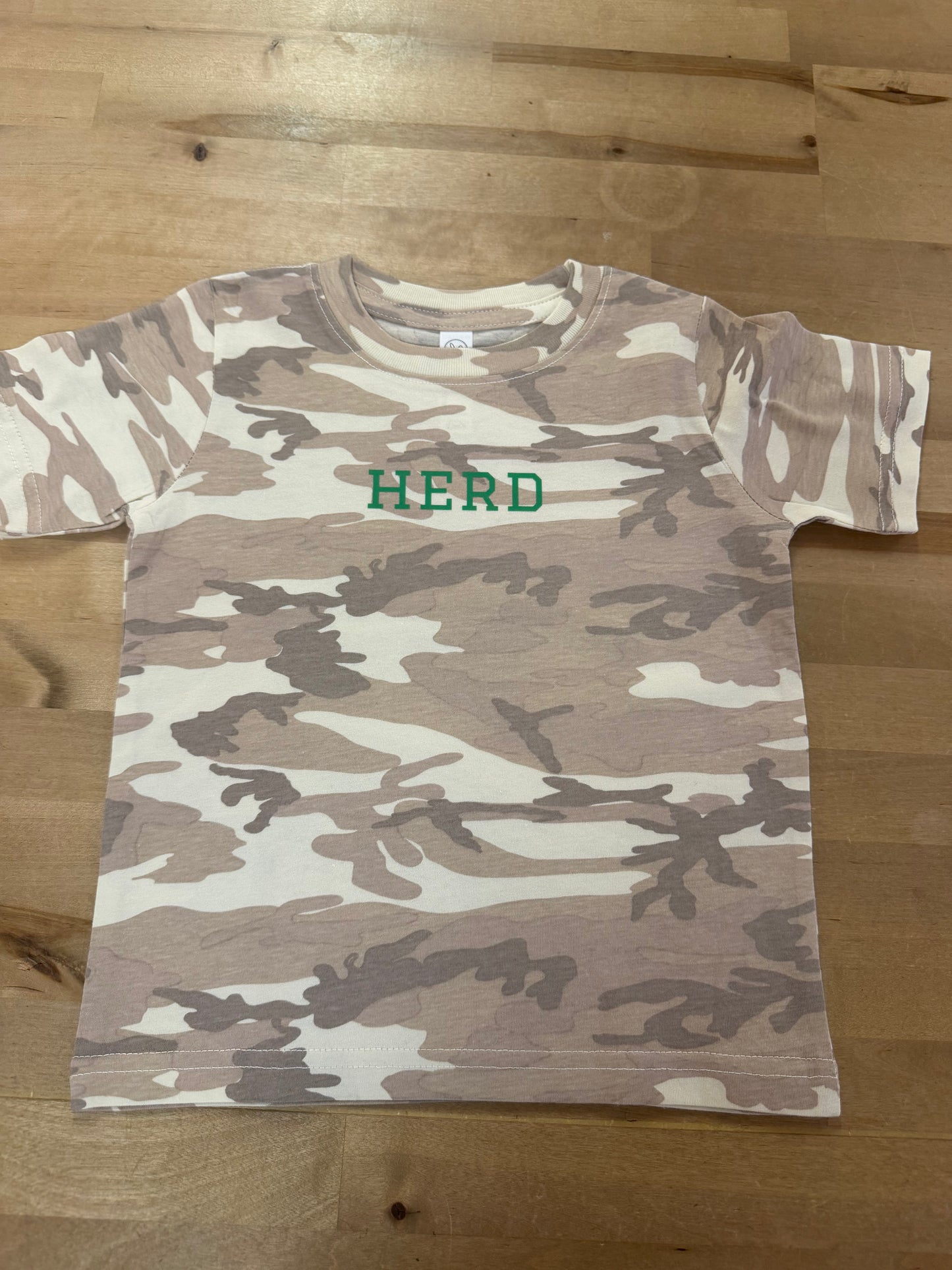 Kids desert camo t-shirt with green HERD text on chest