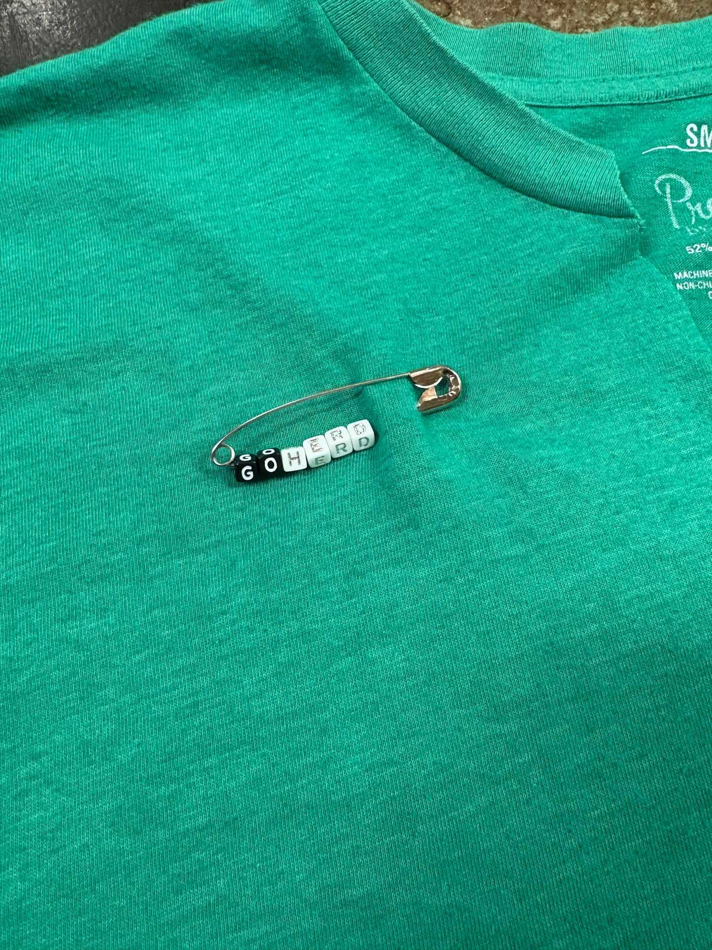 BLEACHER BABE X GREEN OUT TEE