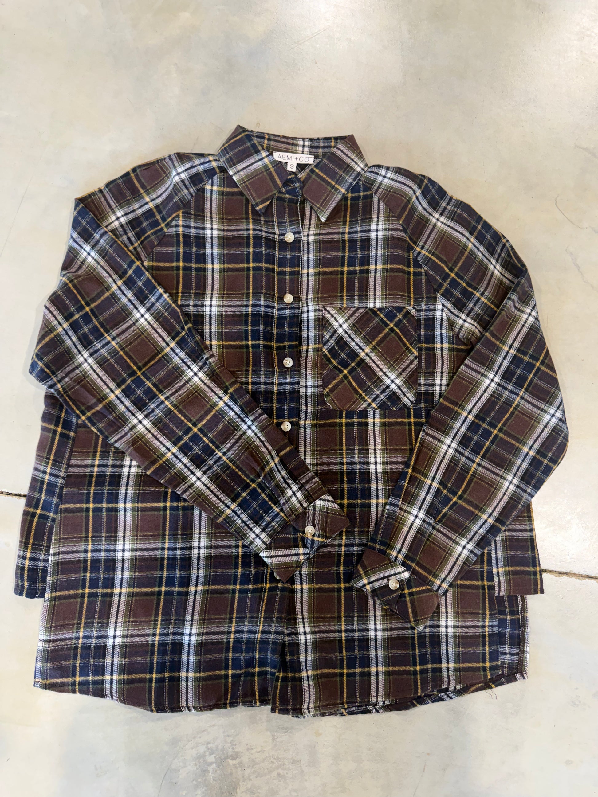 women's aemi + co oversized flannel shirt featuring chocolate brown, navy, cream and mustard plaid, button-down front, long sleeves and chest pocket.