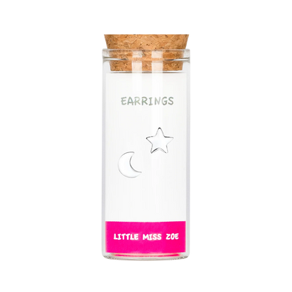 Silver moon and star stud earrings in a glass bottle with cork stopper