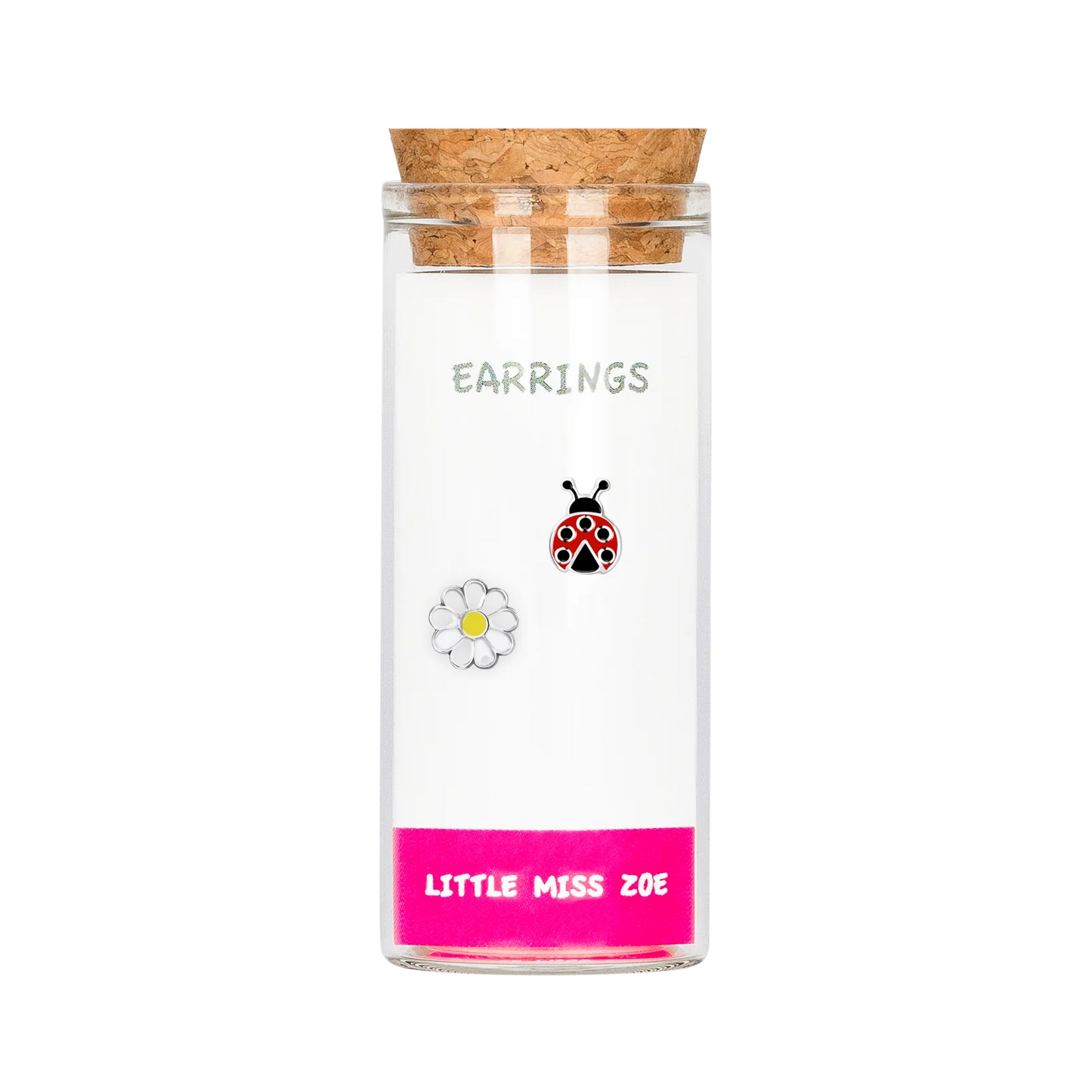 Glass bottle with cork lid containing ladybug and daisy stud earrings, pink base label