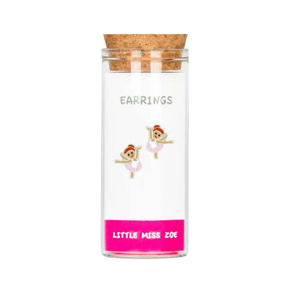 Ballet dancer stud earrings displayed inside a small glass bottle with cork stopper