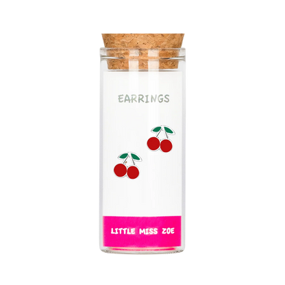 Cherry stud earrings displayed inside a clear glass bottle with cork lid