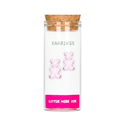 Pink gummy bear stud earrings displayed in a small glass bottle with cork stopper