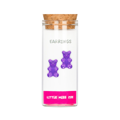 Purple gummy bear stud earrings displayed in a small glass bottle with cork stopper