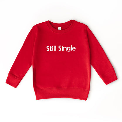 Red sweatshirt with 'Still Single' text