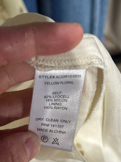 Care label for yellow floral maxi dress, dry clean only, 82% lyocell 18% nylon