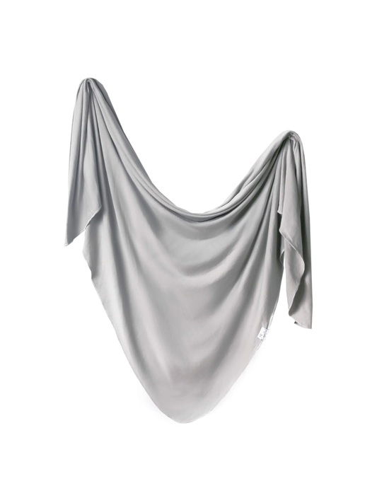 Copper Pearl stone gray knit swaddle blanket draped softly on white background