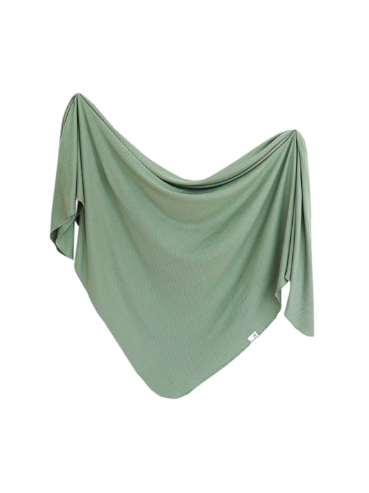 Copper Pearl sage green ribbed knit swaddle blanket draped softly mid-air