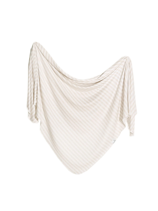 Copper Pearl knit swaddle blanket in beige and white diagonal stripes