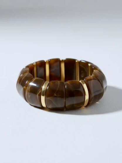 brown lucite stretch bangle bracelet with gold accents