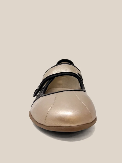 Gold metallic mary jane flat sneaker with black velcro strap, front view