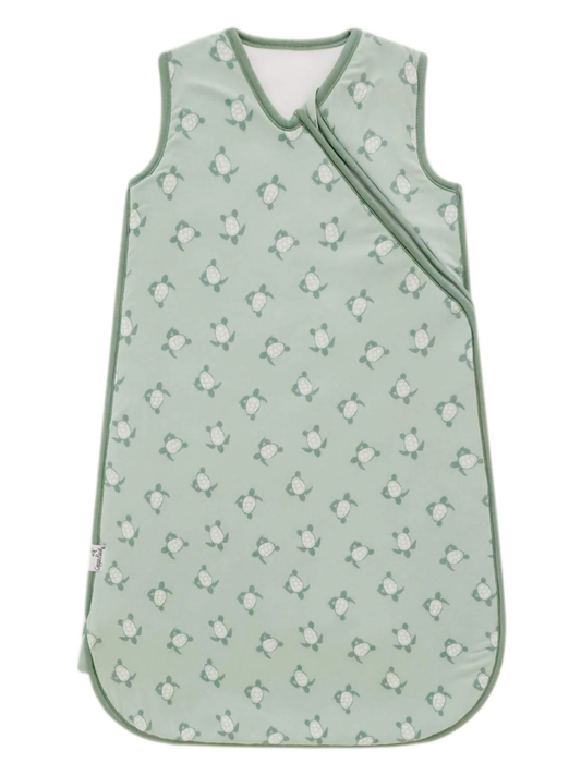 Sage green baby sleep sack with turtle print and wrap-style front closure