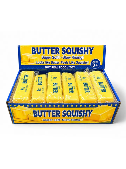 Yellow slow-rising butter stick squishy toys displayed in open retail box, six pieces