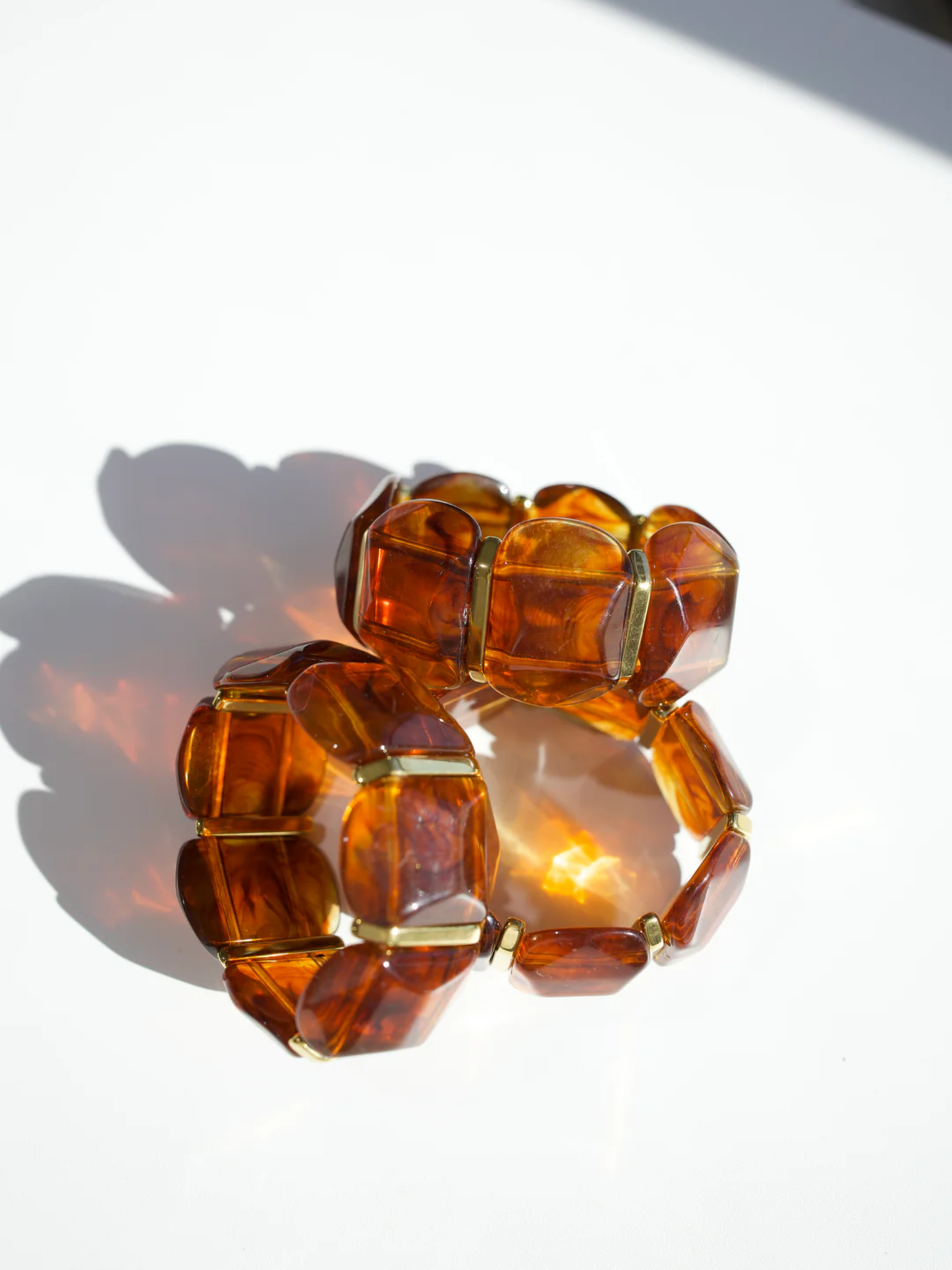 Tortoise amber stretch bracelet with gold spacers, chunky faceted resin stones