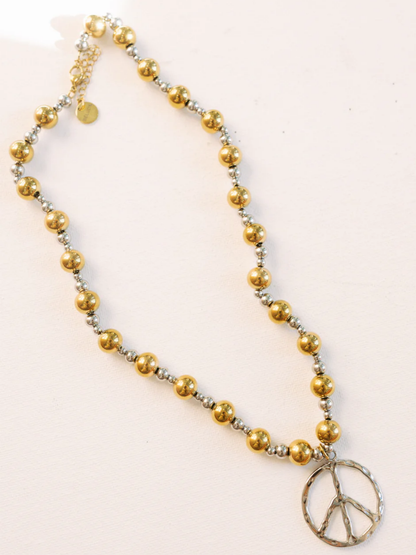 Beaded necklace with gold and silver balls, silver peace sign pendant