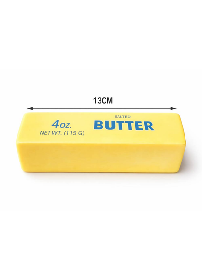Yellow butter stick squishy toy, 13cm long, shaped like salted butter block
