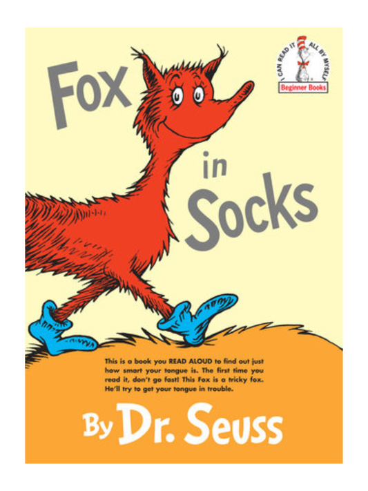 Children's hardcover book with red cartoon fox wearing blue socks on yellow cover