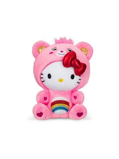 Pink plush bear costume toy with white cat face, red bow, and rainbow belly patch