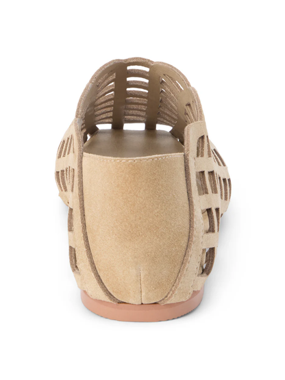 Rear view of beige suede flat shoe with cutout lattice and stripe details