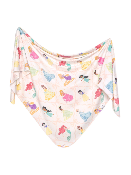 Copper Pearl swaddle blanket with colorful Disney Princess characters on soft pink background