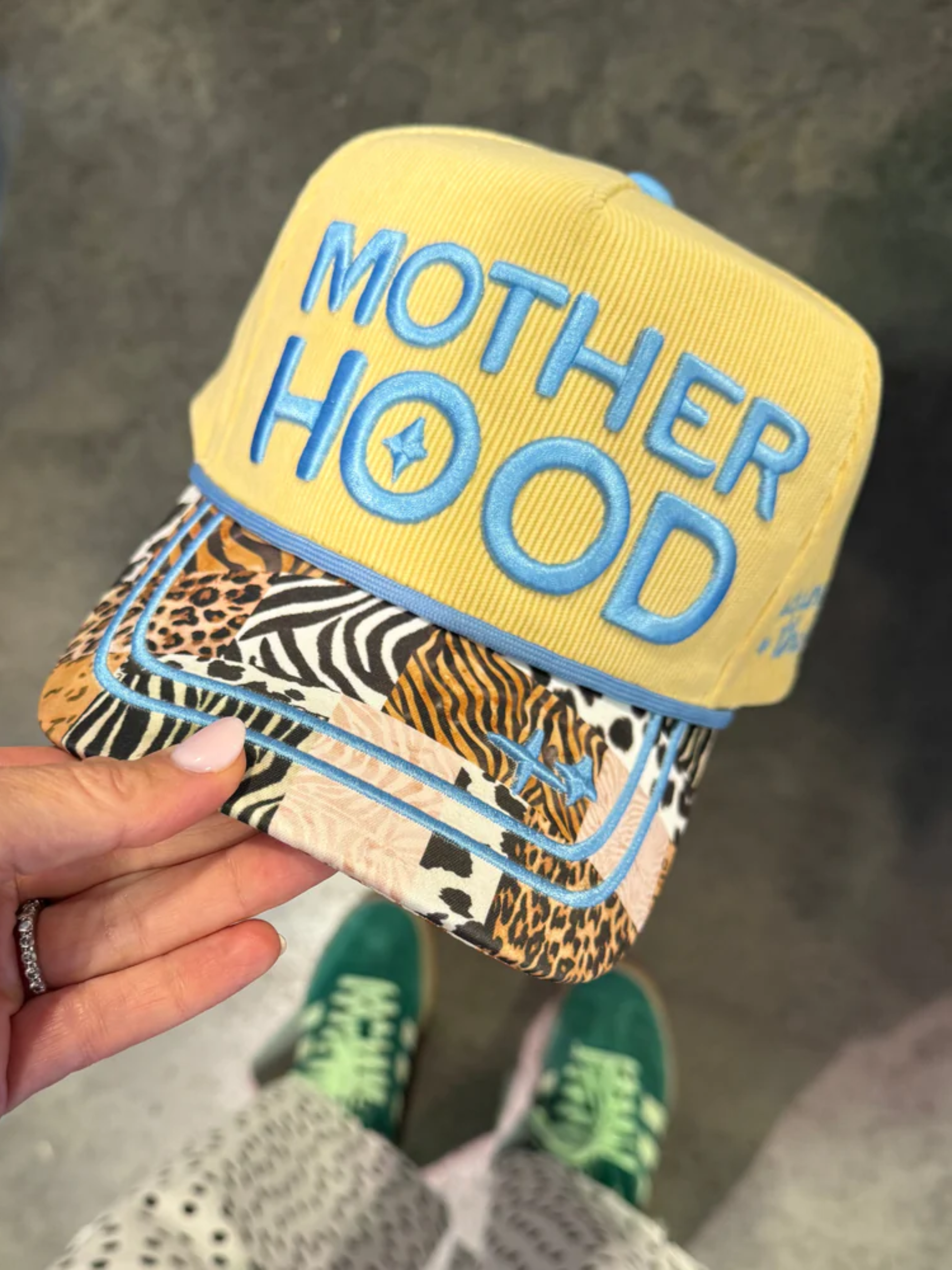 yellow corduroy motherhood trucker hat with animal print bill