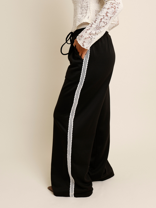 Black pants with white lace trim 