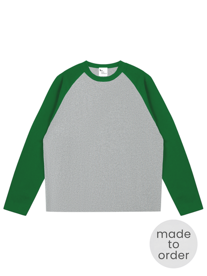 Unisex raglan long sleeve tee with heather gray body and green sleeves