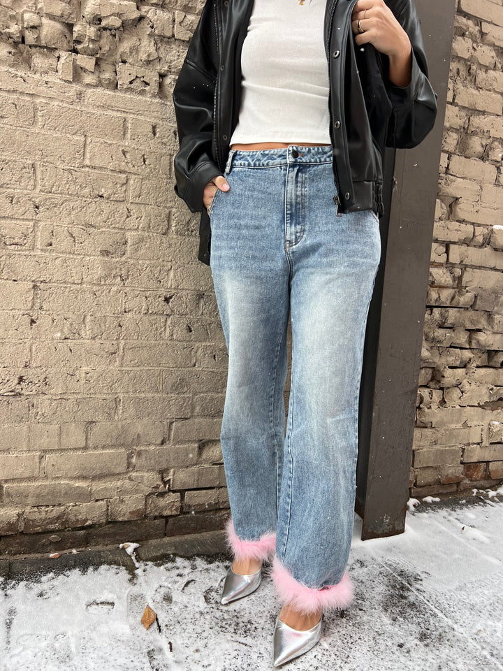 denim jeans with pink feather ankle trim