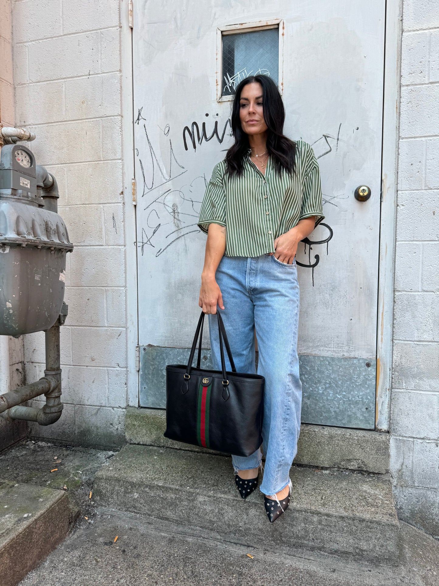 green striped button up and baggy denim jeans 