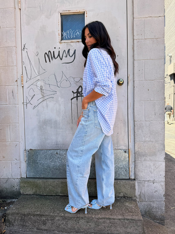 blue gingham print button up shirt and blue barrel jeans