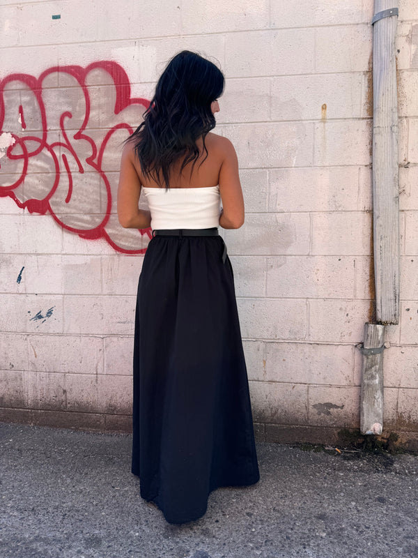 white ribbed strapless top and black maxi skirt