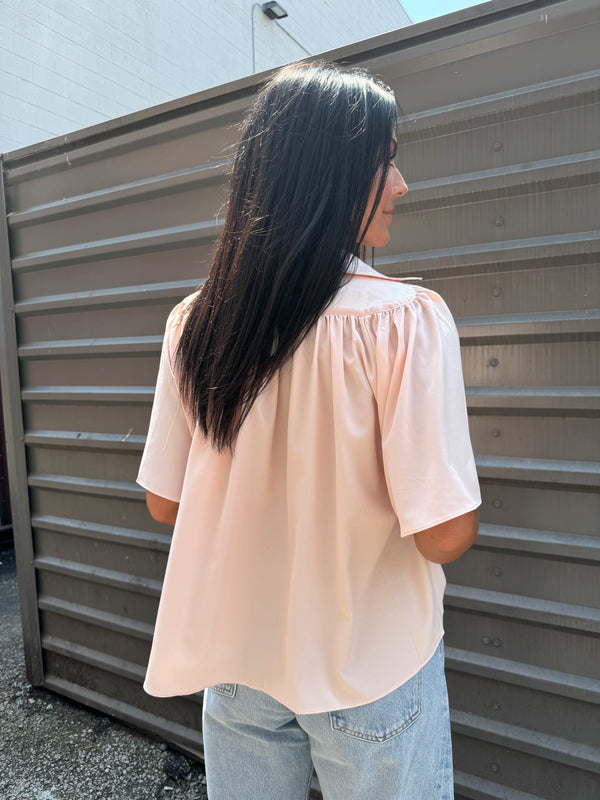 pink flowy blouse