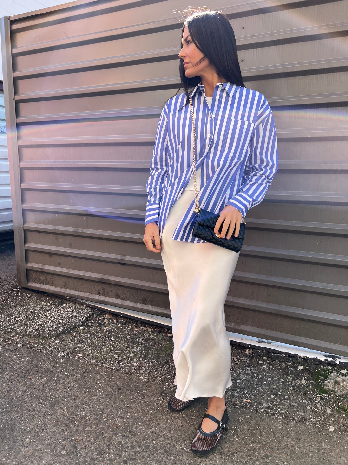 blue and white stripe button up shirt with white slip skirt outfit