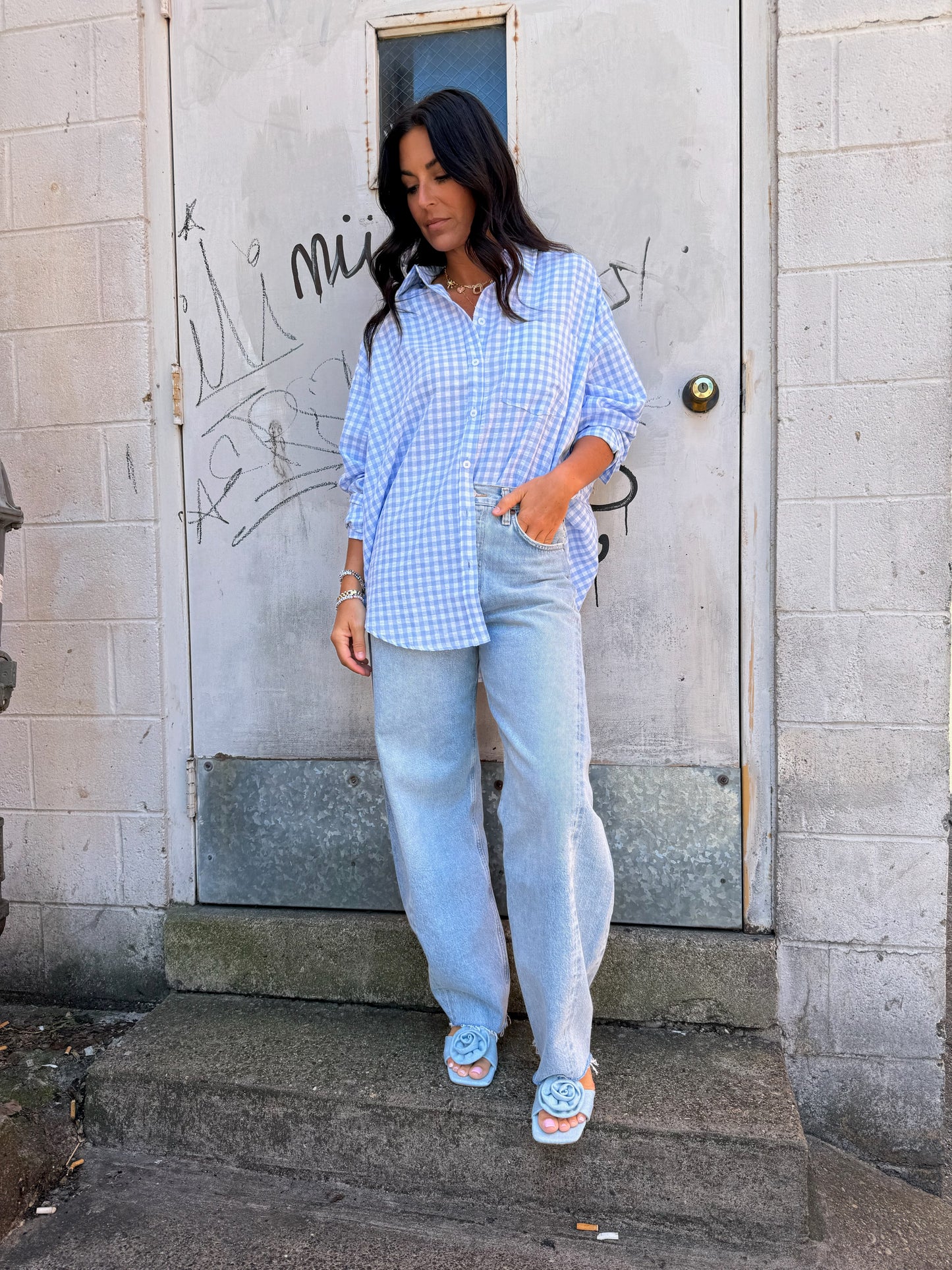 blue gingham print button up shirt and blue barrel jeans