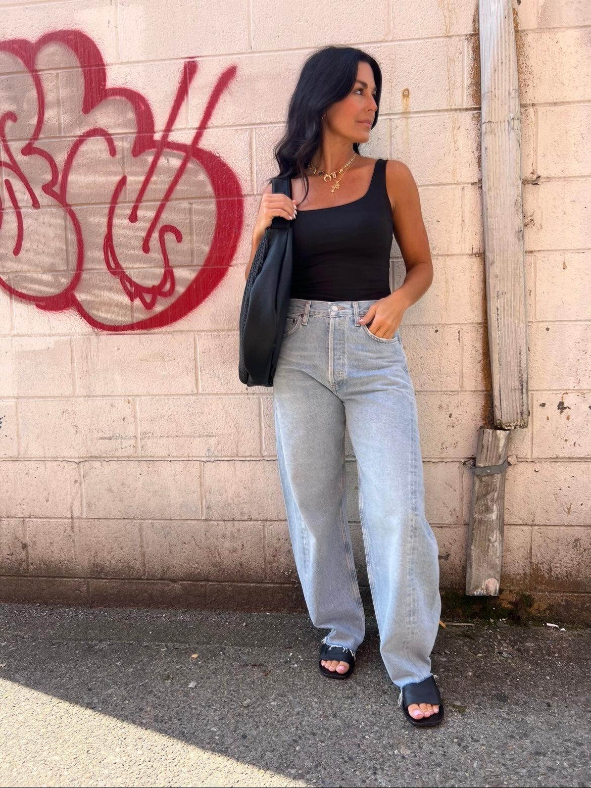 black scoop neck bodysuit and barrel jeans outfit