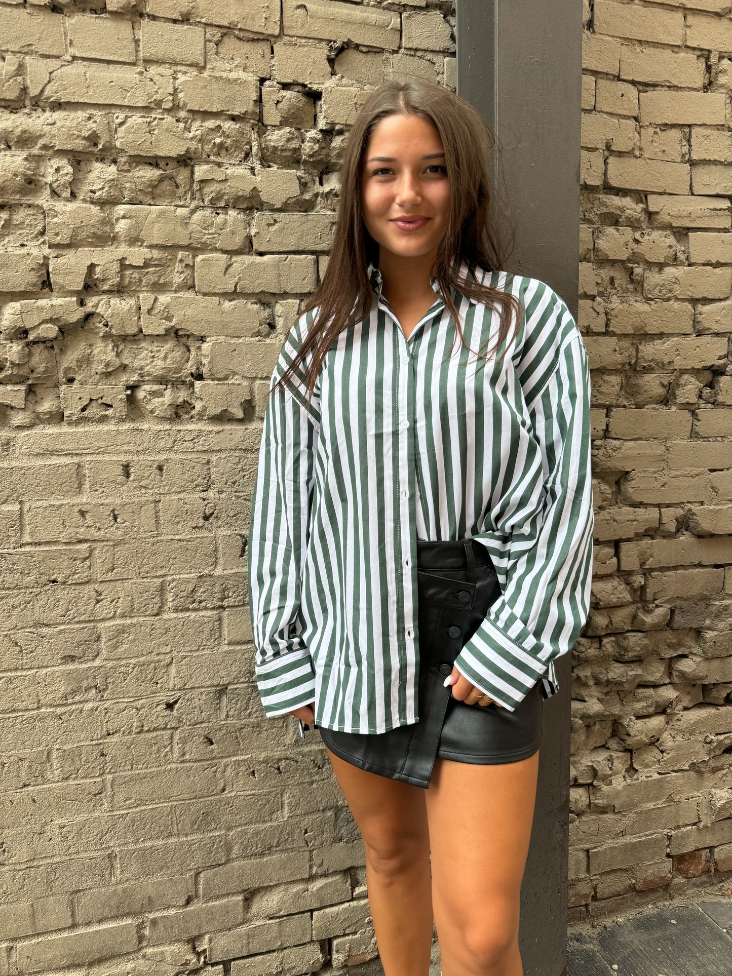 green striped button up shirt and black leather mini skirt outfits