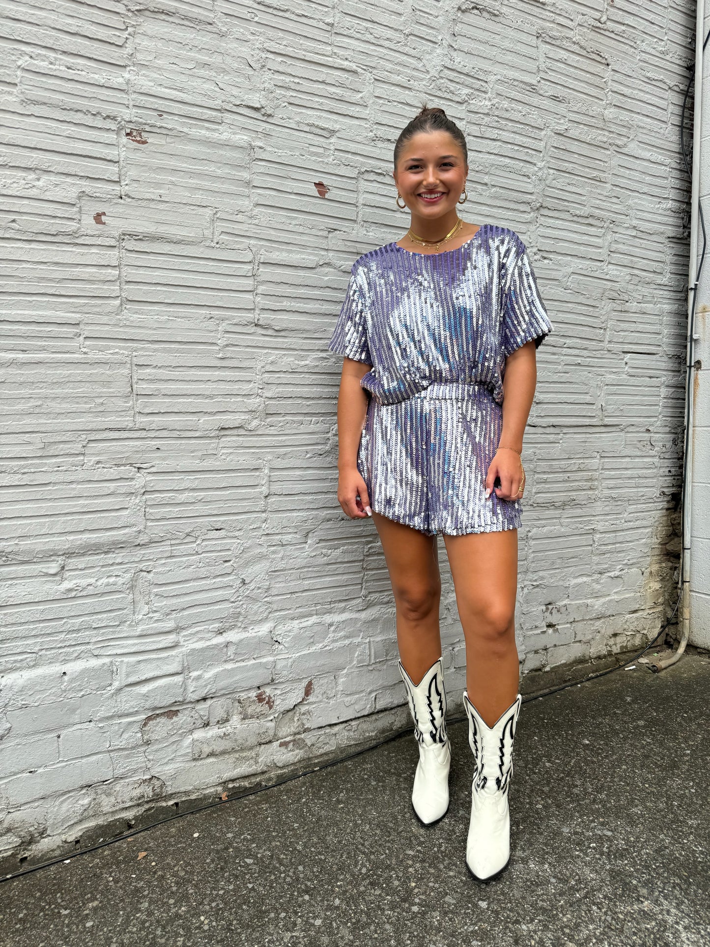 purple sequin set and white norva boots