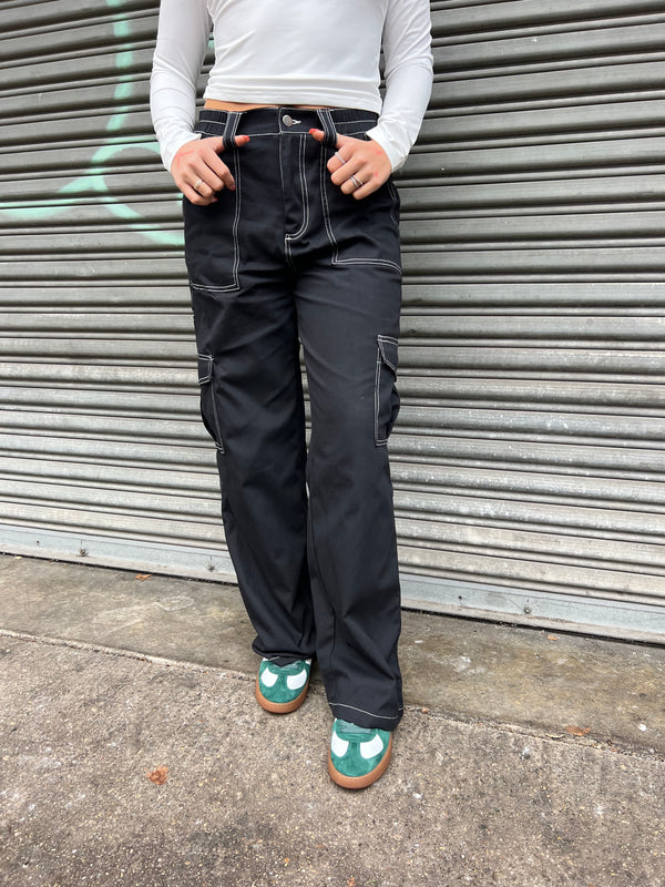 black cargo pants with white exposed stitching