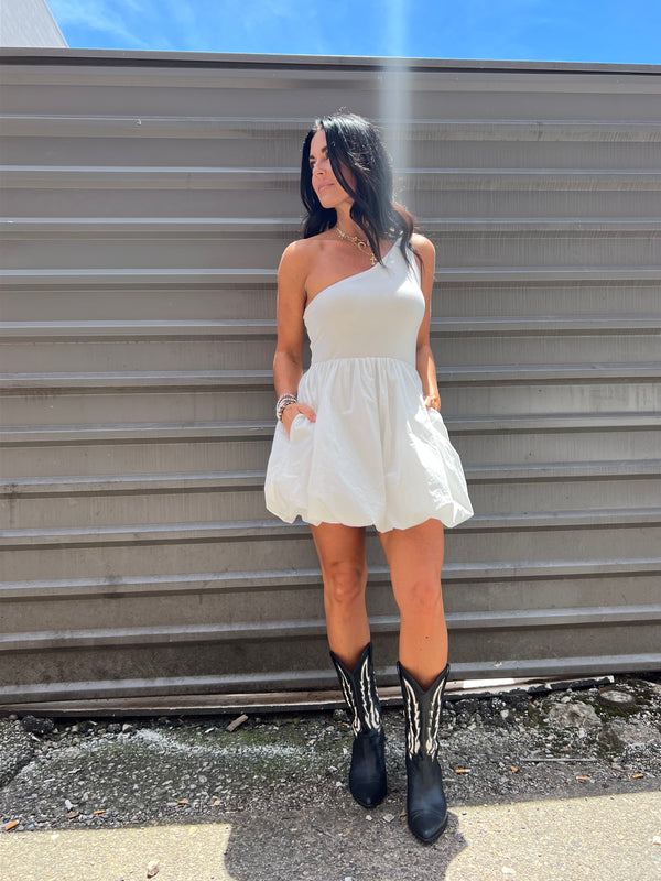 white bubble mini dress with black cowgirl boots