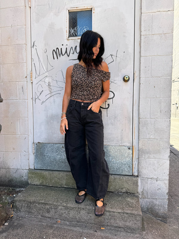 leopard print top and black slouchy jeans