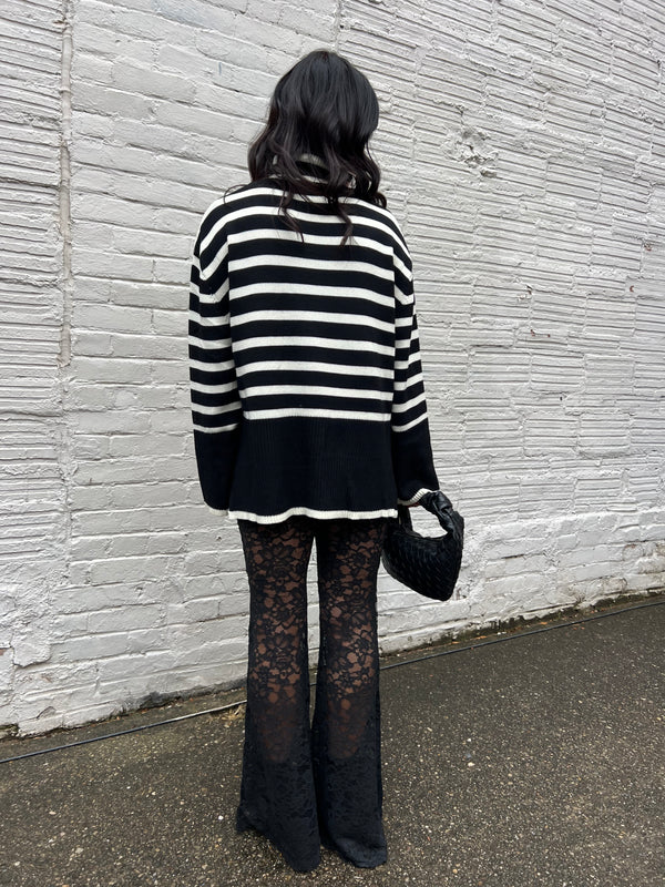black sheer lace flare pants with oversized striped sweater outfit