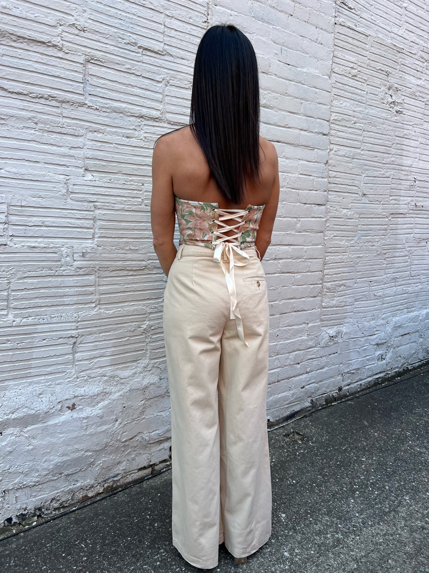 corset top with beige tailored pants